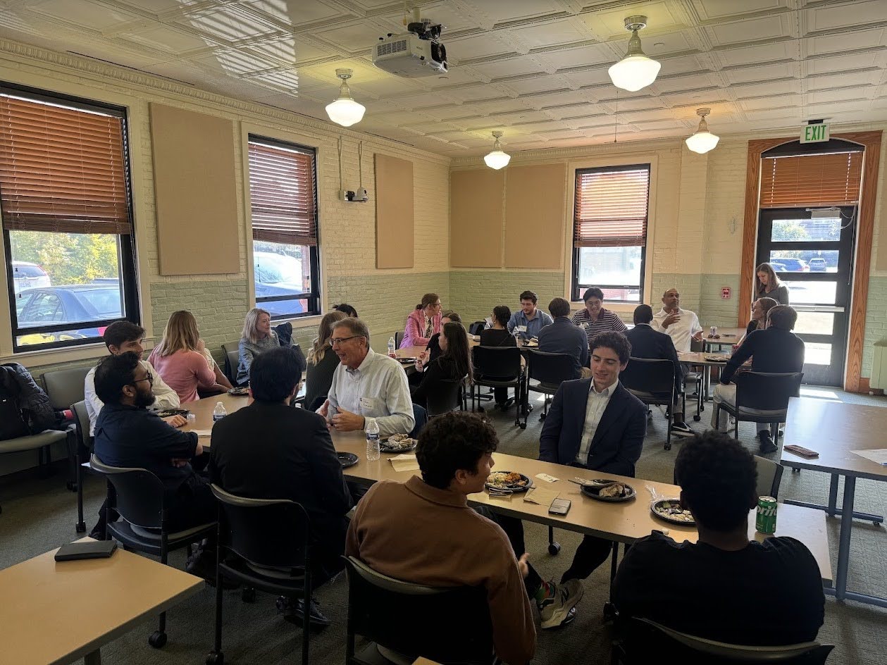 Board members eat lunch with Econ Scholar students.